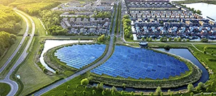 Aerial view of a solar farm surrounded by greenery, representing the Sustainability course